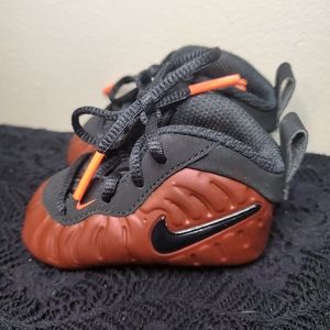 Infant size 2 Nike copper and black shoes